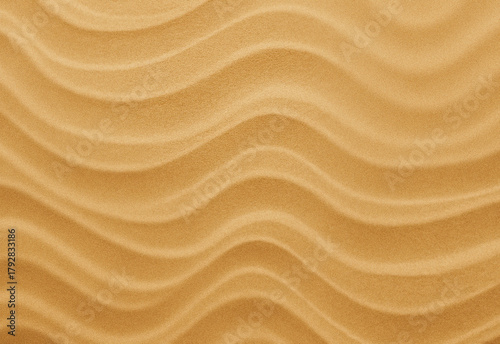 Papier peint Close-up of wind-sculpted desert sand with ripple patterns in warm beige tones,
