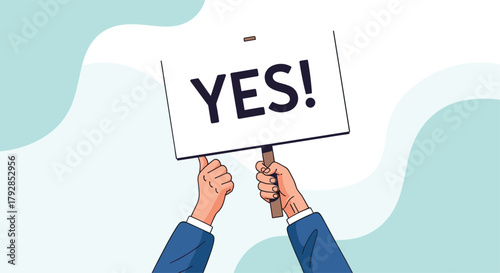 A person is holding a sign with the word yes written on it.