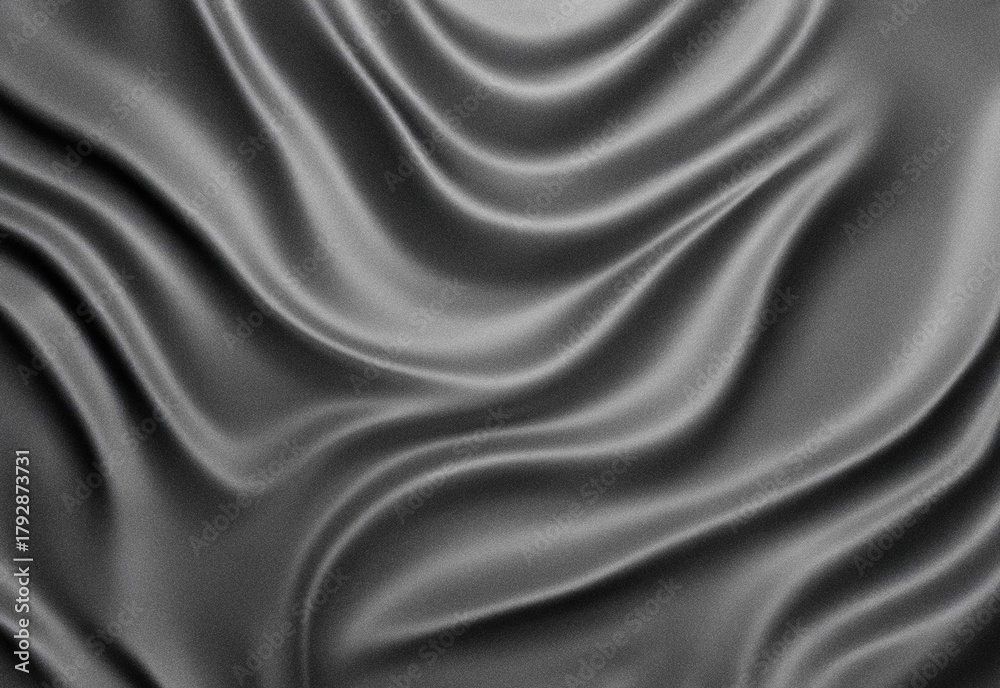 Obraz premium Close-up of smooth silk fabric with flowing folds in grayscale, showcasing texture, soft sheen, and abstract drape, perfect for backgrounds, fashion design, and textile ideas.