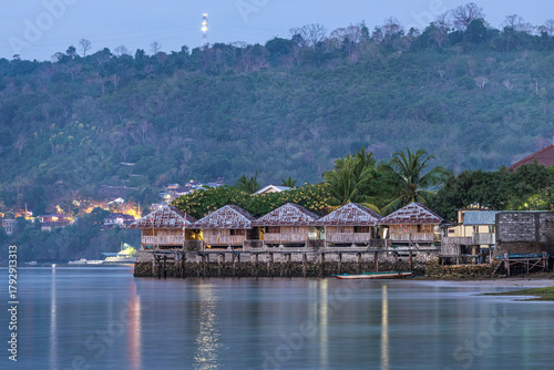 view of the sea with mountain and houses