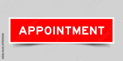 Red color square shape sticker label with word appointment on gray background