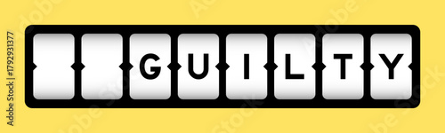 Foto Black color in word guilty on slot banner with yellow color background