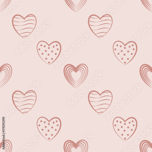 Soft, delicate vector seamless pattern featuring stylized hearts filled with various doodles like stripes and dots, all in a soothing monochromatic blush pink palette.