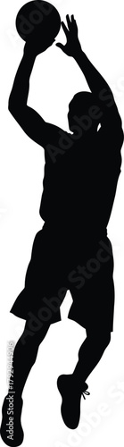 Silhouette of a basketball player shooting a ball in mid air