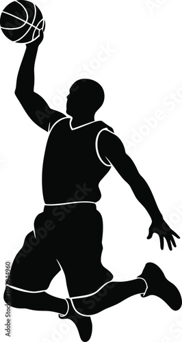 Silhouette of a basketball player dunking a basketball in mid air