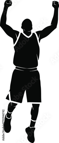 Silhouette of a basketball player celebrating with arms raised