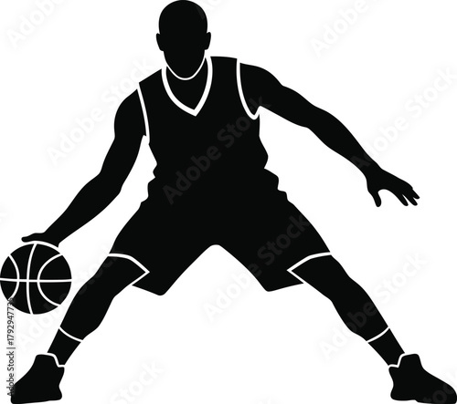 Silhouette of a basketball player dribbling the ball