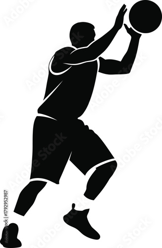 Silhouette of a basketball player in mid jump shooting the ball