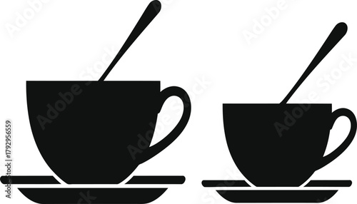 Two black silhouette coffee cups with spoons and saucers drink beverage