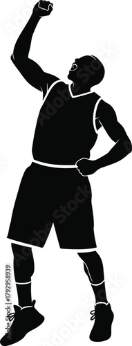 Silhouette of a basketball player shooting a ball