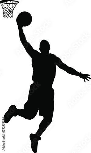 Silhouette of a basketball player dunking a basketball
