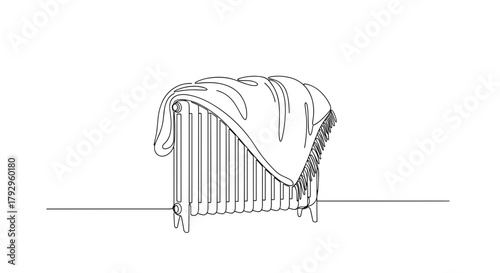 Blanket on heater symbolizing comfort, simplicity and domestic warmth