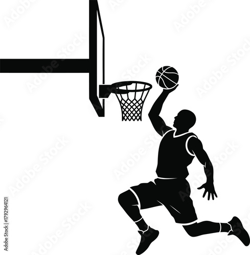 Silhouette of a basketball player dunking the ball