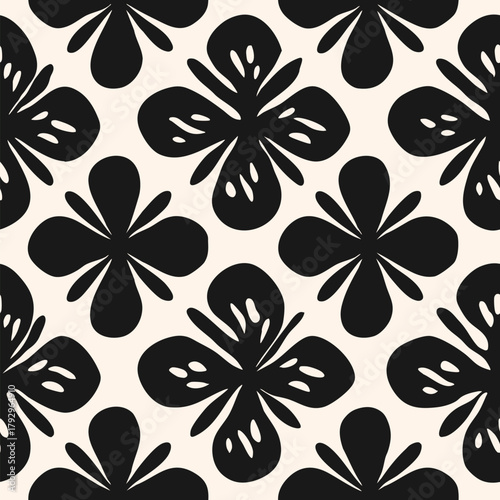 Primitive style floral seamless pattern with organic black flower shapes on white background. Bold cutout botanical silhouettes with decorative petals. Modern repeated design for textile, print