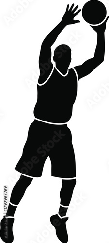 Silhouette of a basketball player jumping to shoot a ball