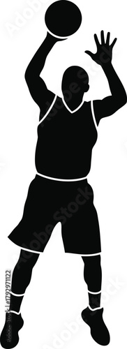 Silhouette of a basketball player shooting a ball