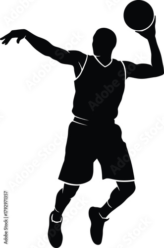 Silhouette of a basketball player in mid air shooting the ball