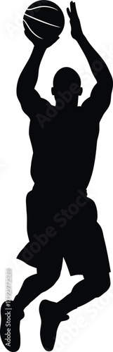 Silhouette of a basketball player mid air shooting a ball