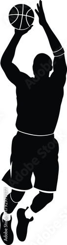 Silhouette of a basketball player shooting a ball mid air