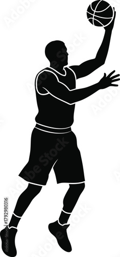 Silhouette of a basketball player dunking a ball