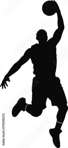 Silhouette of a basketball player performing a slam dunk