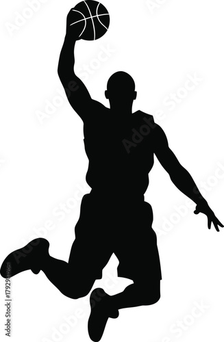 Silhouette of a basketball player dunking the ball