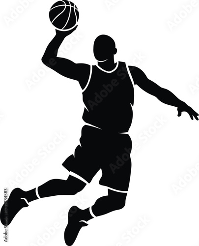 Silhouette of a basketball player dunking a ball