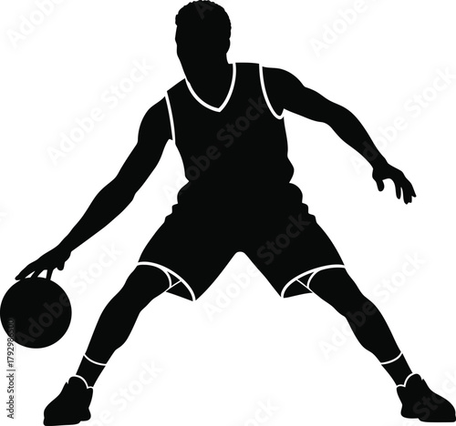 Silhouette of a basketball player dribbling the ball