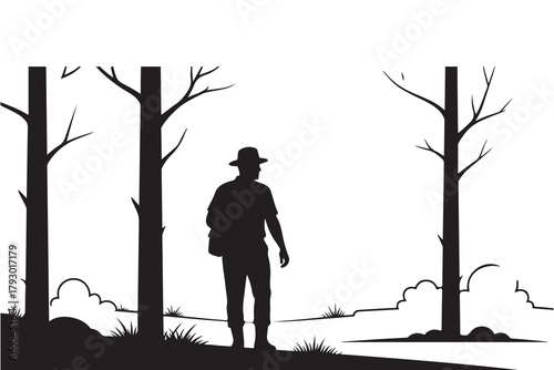 Silhouette of a hiker standing in a forest clearing