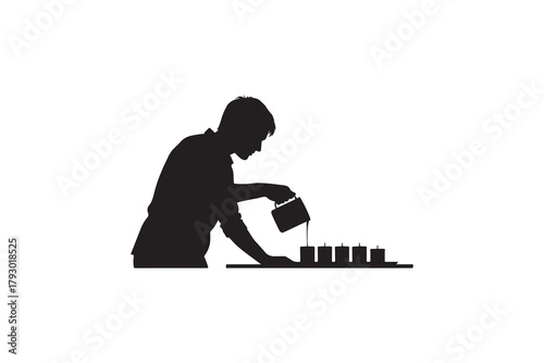 Silhouette of person pouring liquid into candle molds