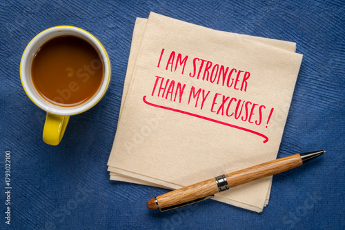 I am stronger than my excuses - motivational note handwritten on a napkin with a cup of coffee, positive affirmation and personal development concept.