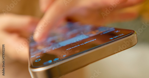 Close up woman scrolling through social media app on smartphone, engaging with digital content and staying connected in modern communication landscape