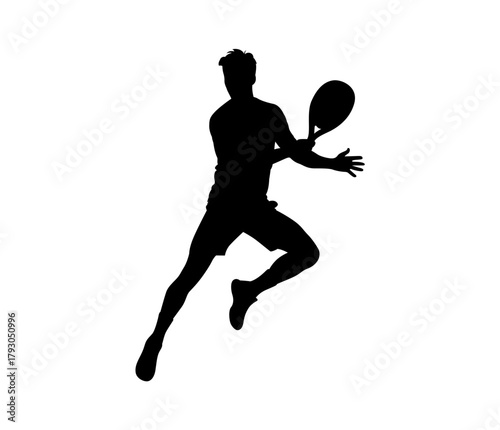 Silhouette of a male tennis player in motion swinging a racket during a match