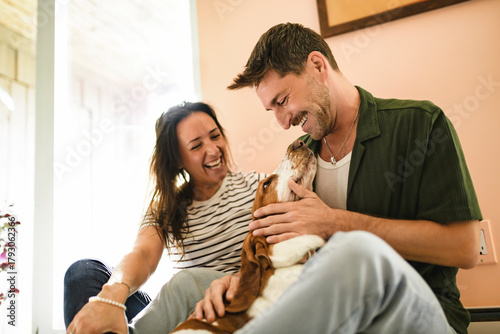 Couple and her Basset dog at home having great time