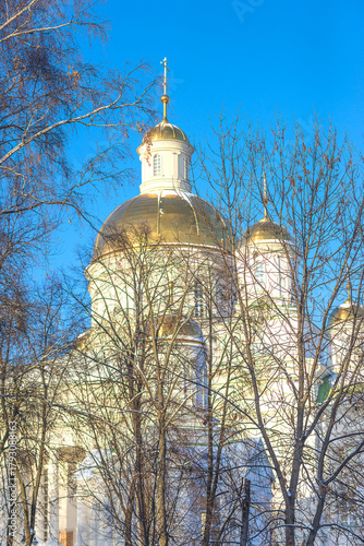 Beautiful orthodoxe church with golden domes on a blue sky