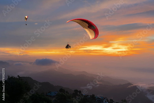 Paragliding over the clouds sunset view at Bir Billing Himachal Pradesh India. Clouds in the sky, Dhauladhar peaks view