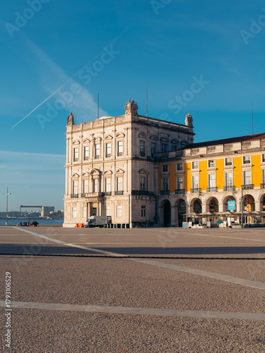 View of the Terreiro do Paco square, where ornate buildings stand against the clear blue sky, inviting exploration, Lisbon, Lisbon, Portugal.