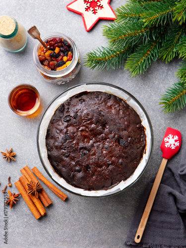 Christmas pudding in baking dish. Grey background. Top view.