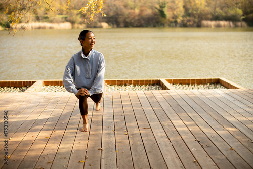 Korean woman stretches by t...