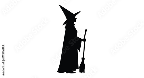 Silhouette of a classic witch figure holding a broomstick in profile