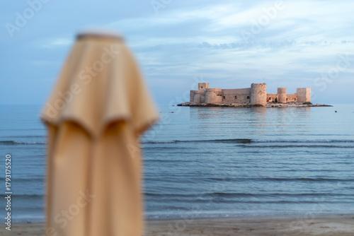 Fototapeta Naklejka Na Ścianę i Meble -  The famous historical Maiden's Castle in the Erdemli district of Mersin, Turkey. Known as Kız Kalesi in Turkish. Holiday concept with view of Maiden's Castle.