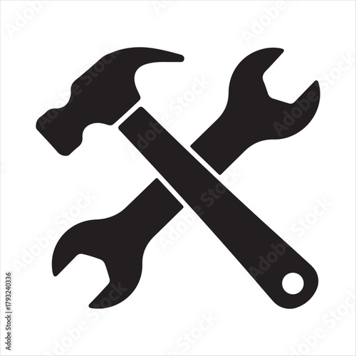 Black silhouette of a hammer and wrenches crossed together on a white background