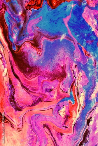 Abstract multicolored background. The acrylic paint flows and creates a unique pattern. Bright shades. Background of the rear view.