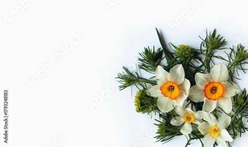 A cheerful bouquet with daffodils on a light background.