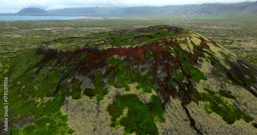 Aerial Cinematography of the Búðaklettur Extinct Volcano in Iceland – A Mesmerizing Journey Across Its Striking Crater, Colorful Lava Formations, and the Boundless Wilderness of the Nordic Highlands.