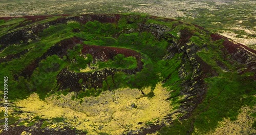 Cinematic Drone Journey Over the Extinct Búðaklettur Volcano in Iceland. A Stunning Aerial Exploration of Vibrant Moss-Covered Slopes, Rugged Crater Walls, and the Untamed Majesty of Iceland’s Volcano