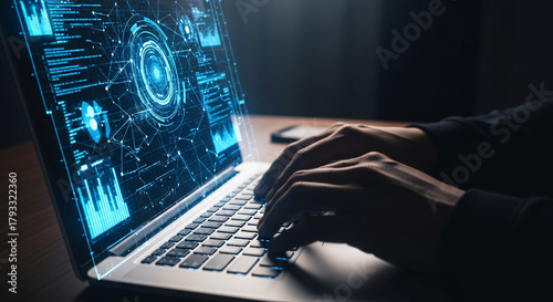 Person Typing on Laptop with Futuristic Data Visualization