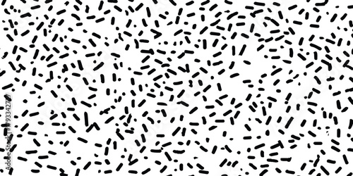 Abstract black dot pattern on white background. Black speckles scattered across white background dots spots.