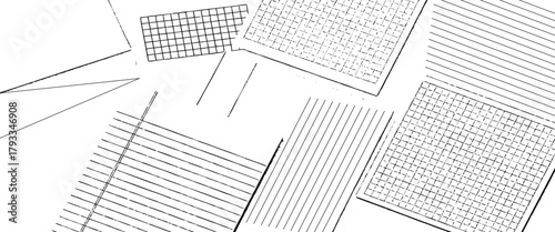 Scattered sheets of paper with lines and grids creating a chaotic yet organized monochrome pattern.