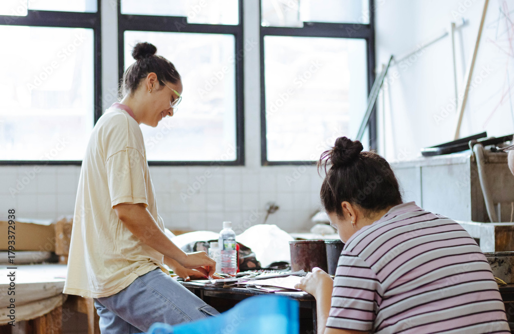 Fototapeta premium Art students creating during a workshop, focusing on creativity, learning, and collaboration in a studio environment